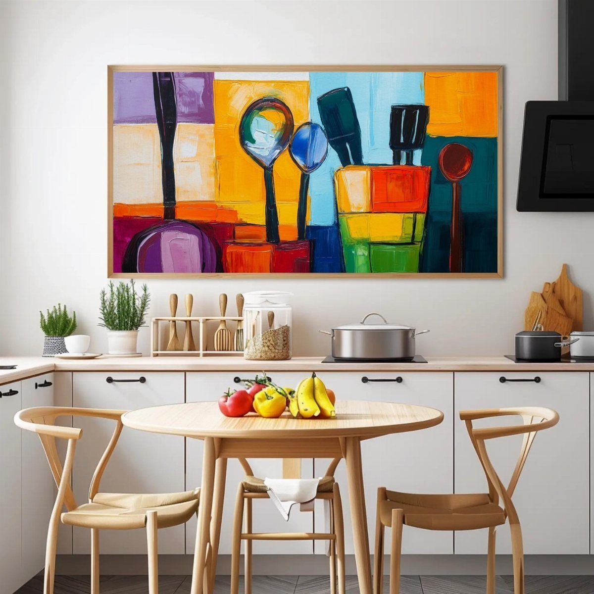 Colorful abstract painting of utensils hanging on a white kitchen wall above a table