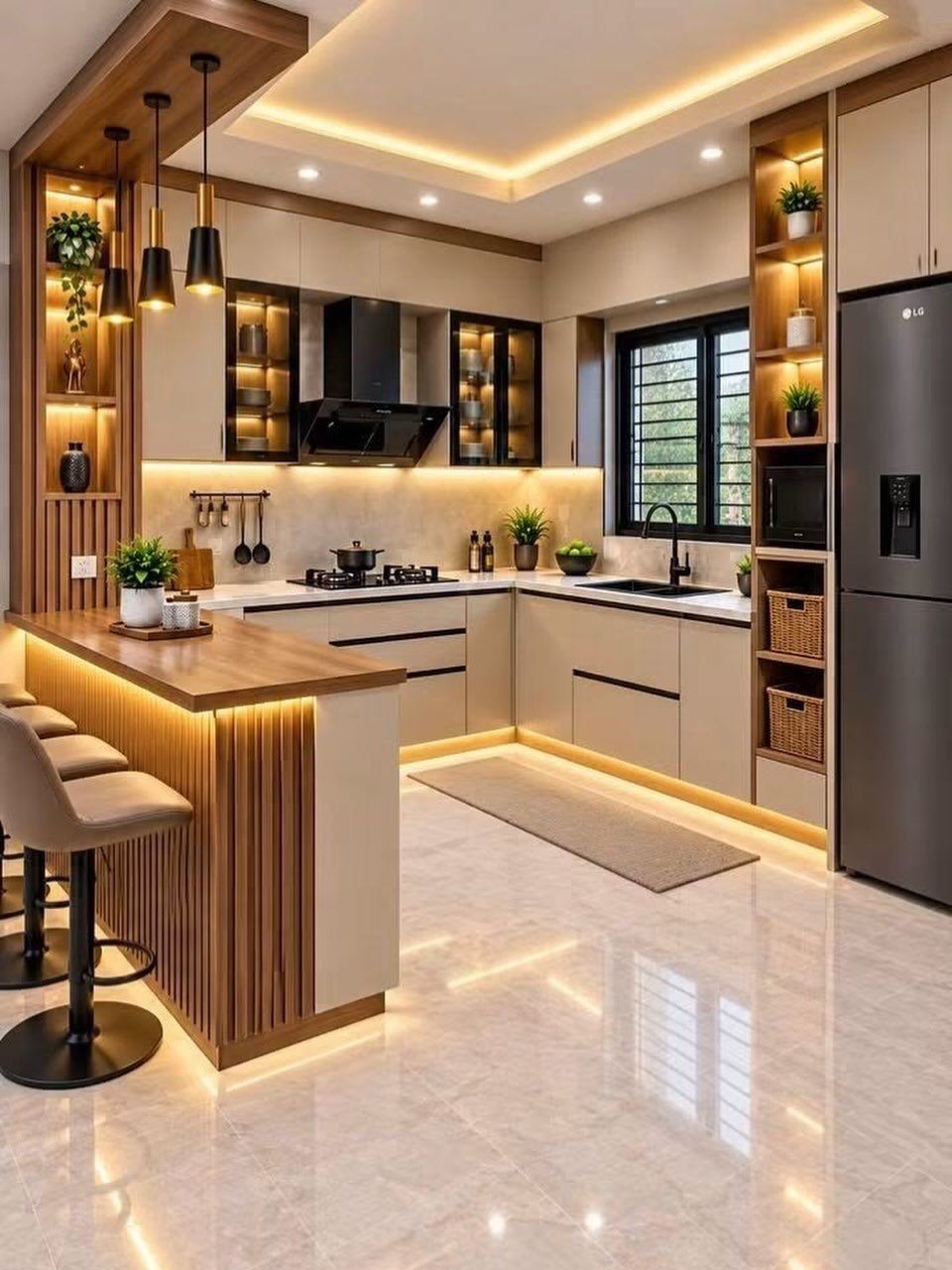Modern kitchen featuring warm interior cabinet lighting and sleek beige cabinetry with wood accents.