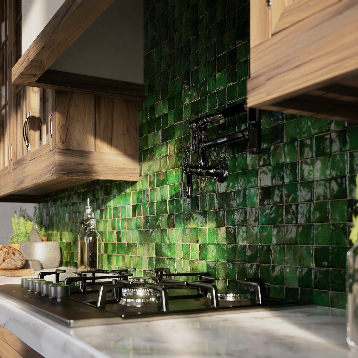 Green multi-tonal square tile backsplash behind a black gas stove and marble counter