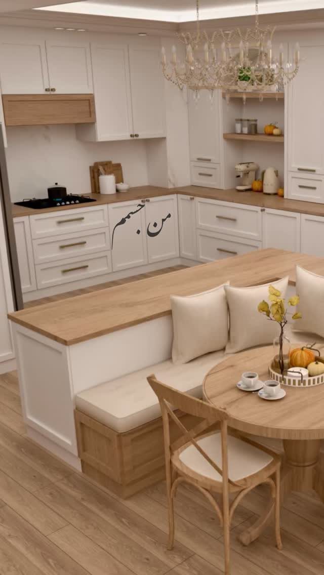 Kitchen island with a built-in bench seat and round wooden dining table.