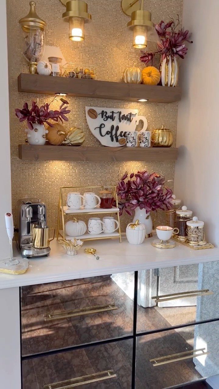 Coffee bar nook with gold wallpaper, floating shelves, and a white countertop.