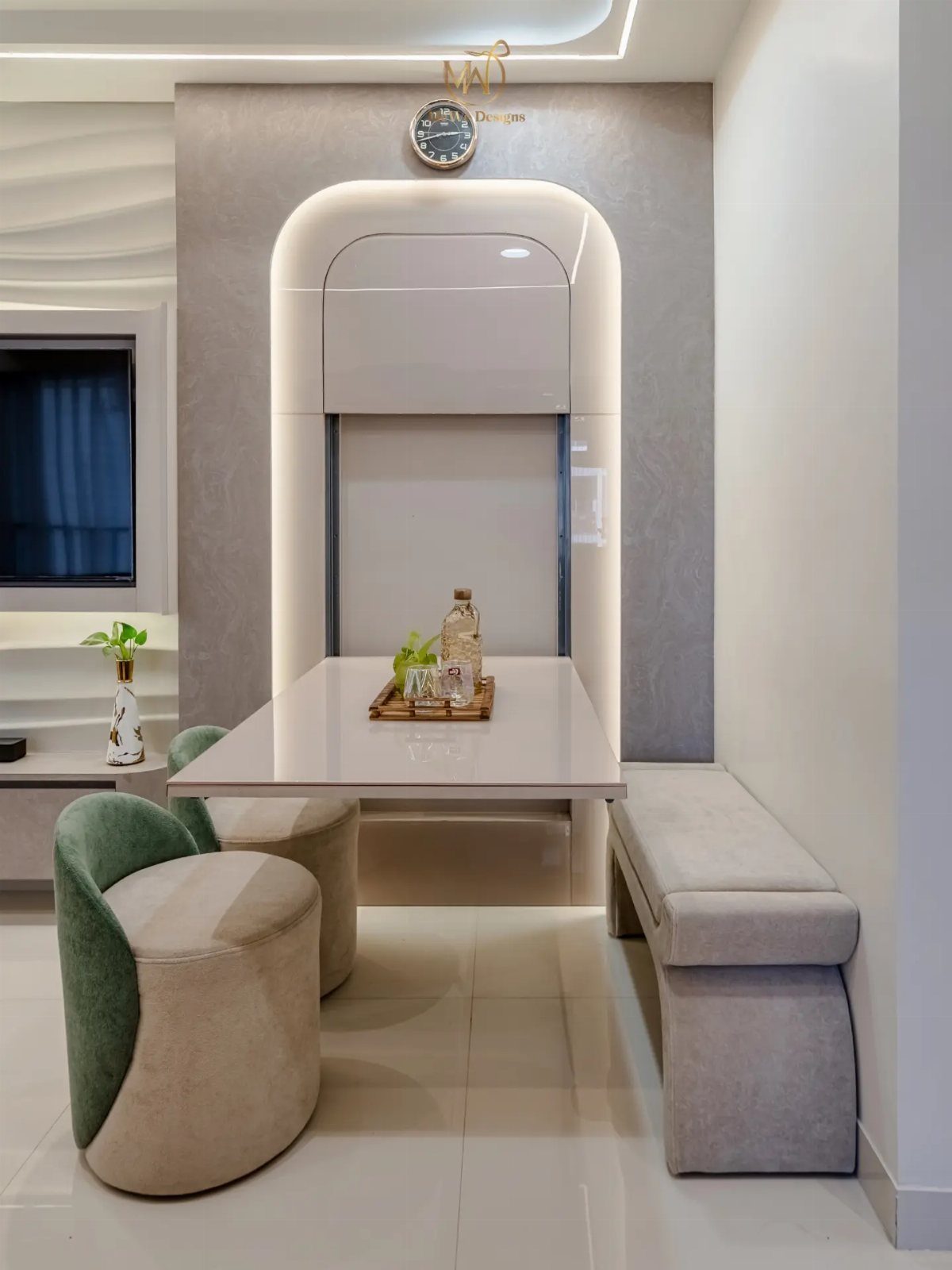 Modern white dining table with curved chairs and bench in a small space.