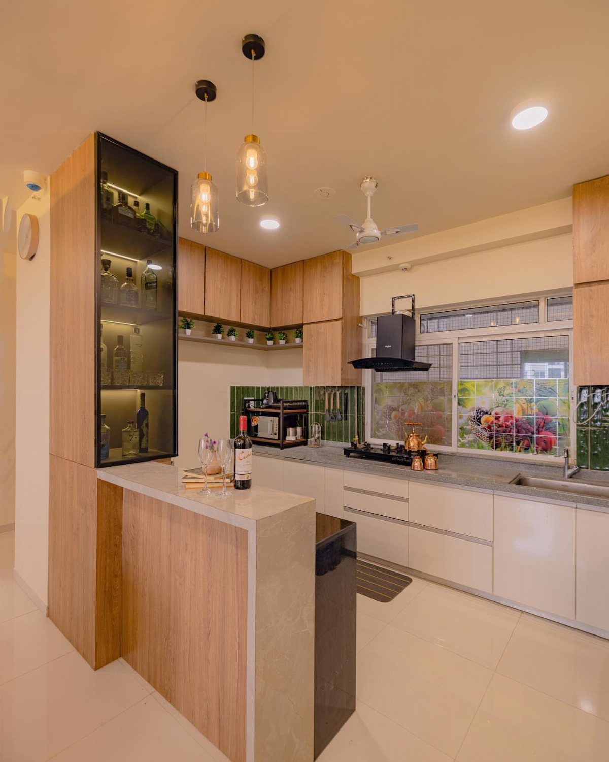Narrow breakfast bar with light wood finish in a modern white kitchen