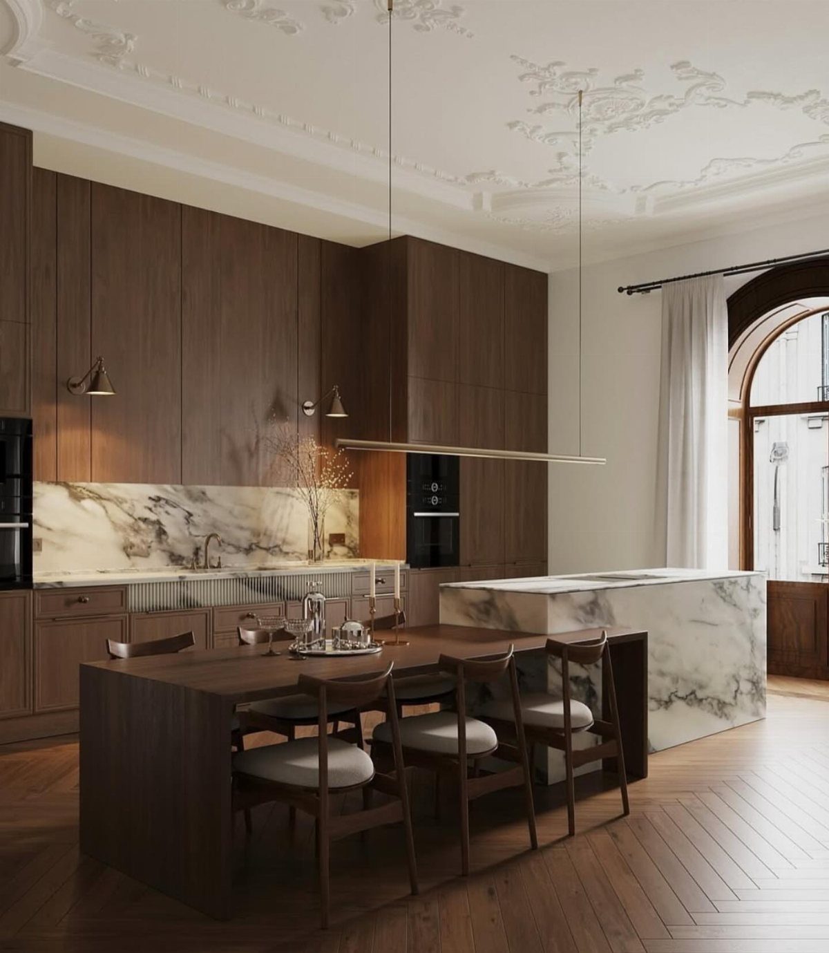 Dark wood dining table attached to a white marble kitchen island in modern room