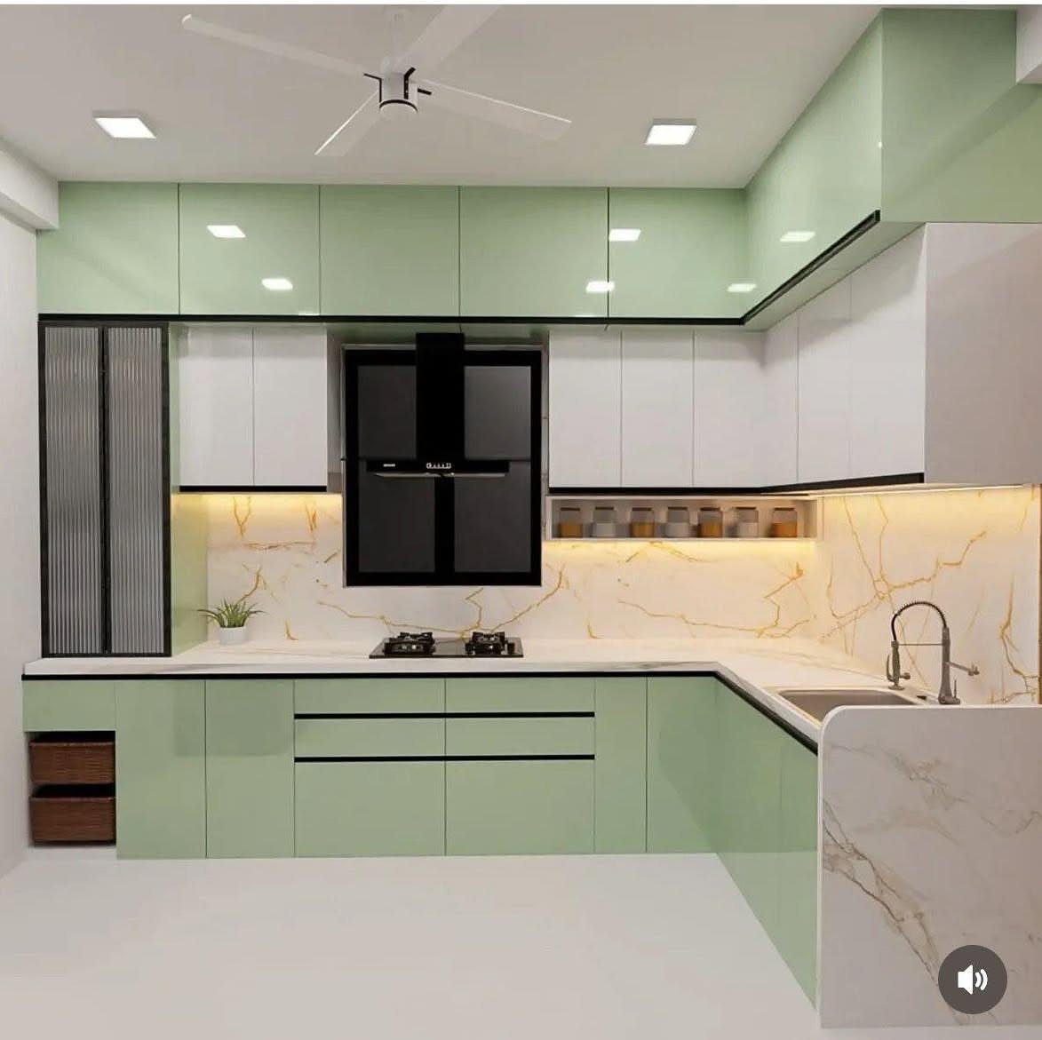 Modern kitchen with pale green and white glossy cabinets and marble countertops.